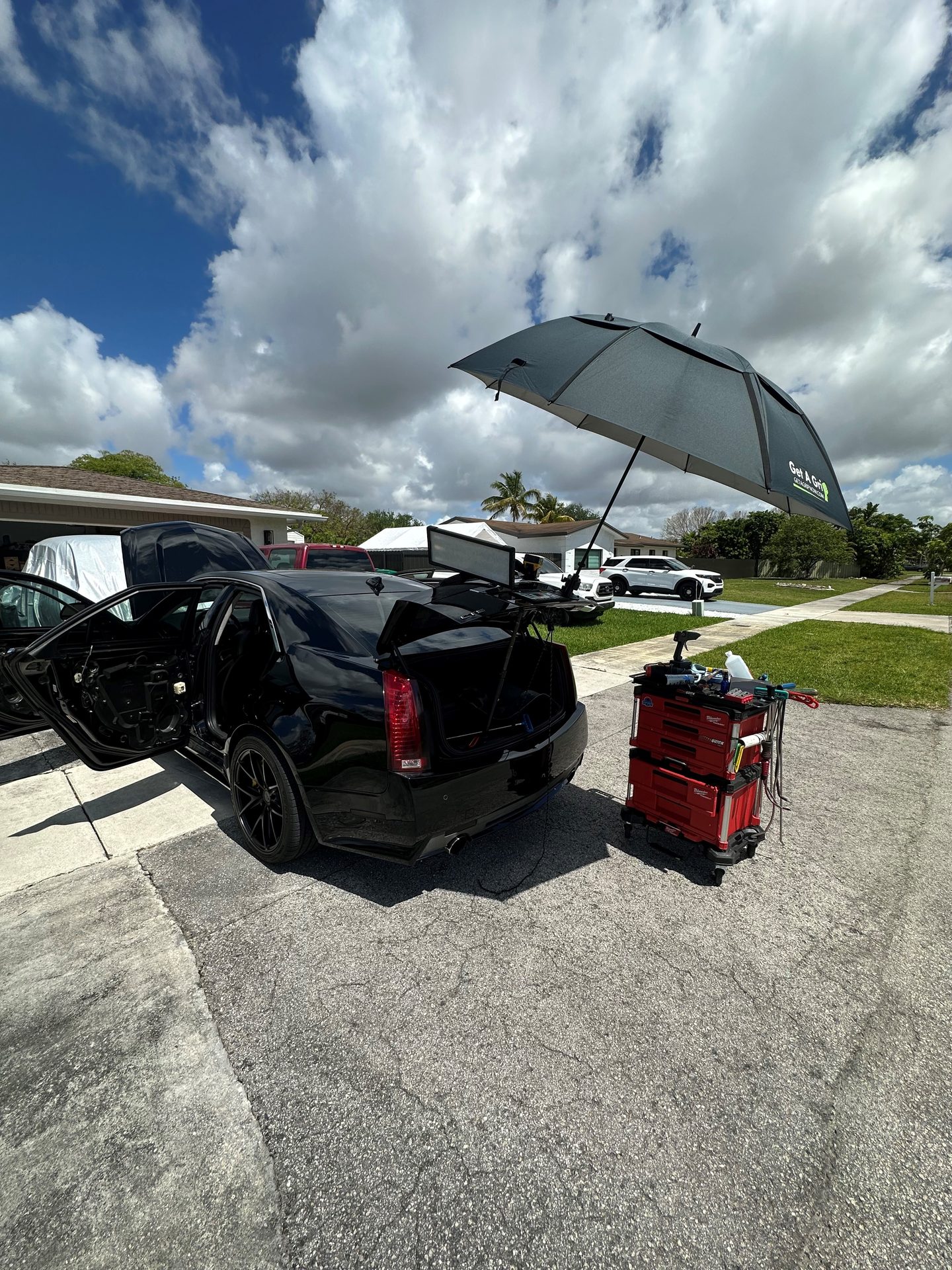 Collision dent paintless repair on a Cadillac, Miami