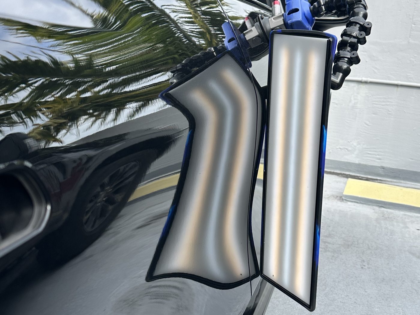 After paintless dent repair — dent removed, factory paint untouched, Caliber PDR Miami